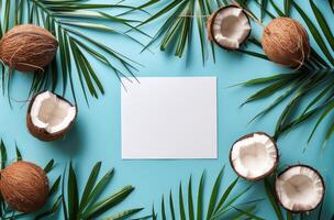 Paper Surrounded by Coconuts on Blue Background photo