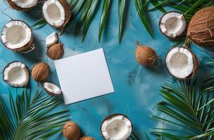 Paper Surrounded by Coconuts on Blue Background photo