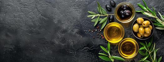 Olives and Olive Oil on a Black Background photo