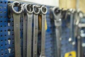 Wrenches hanging on the shelf photo