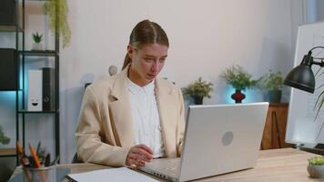 Happy business woman looking approvingly at camera showing thumbs up, like positive sign, good news video