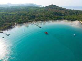 Aerial drone view of beautiful beach with turquoise sea water and trees of Gulf of Thailand. Kood island, Thailand photo