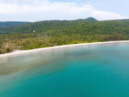 Aerial drone view of beautiful beach with turquoise sea water and palm trees of Gulf of Thailand. Kood island, Thailand photo