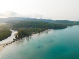 Aerial drone view of beautiful beach with turquoise sea water and palm trees of Gulf of Thailand. Kood island, Thailand photo