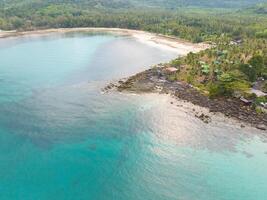 Aerial drone view of beautiful beach with turquoise sea water and palm trees of Gulf of Thailand. Kood island, Thailand photo