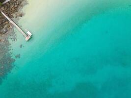 Aerial drone view of beautiful beach with turquoise sea water and palm trees of Gulf of Thailand. Kood island, Thailand photo