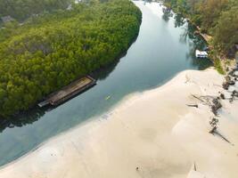 Aerial drone view of beautiful beach with turquoise sea water and palm trees of Gulf of Thailand. Kood island, Thailand photo