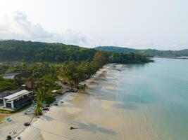 Aerial drone view of beautiful beach with turquoise sea water and palm trees of Gulf of Thailand. Kood island, Thailand photo