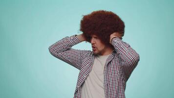 Frustrated irritated young man covering ears, avoiding advice ignoring unpleasant noise loud voices video