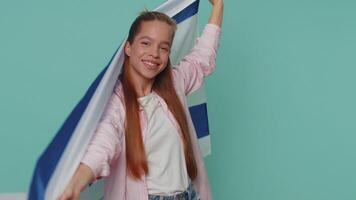 Teen girl kid in shirt top waving and wrapping in Israel national flag, celebrating Independence day video