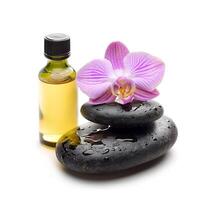 Essentiale ol and massage stone with orchids flower photo