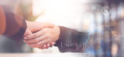 Businessmen shaking hands to indicate a business deal,successful contract management of the company,signing an agreement,business partner,New opportunities for the future of the industry,joint venture photo