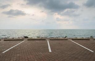 Empty parking lot with seascape photo