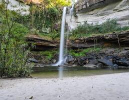 Deep forest waterfall with sand beach in Ubon Ratchathani, Thailand photo