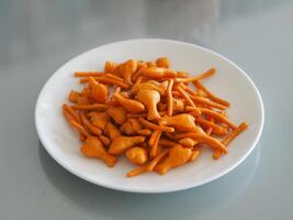 closeup chippy snack food salt in white plate photo