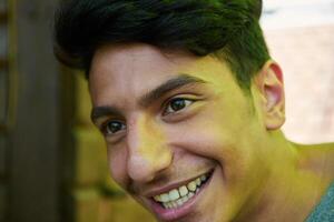 Middle Eastern Man with a Radiant Smile and Beautiful White Teeth Captured in Closeup photo