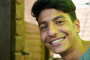 Middle Eastern Man with a Radiant Smile and Beautiful White Teeth Captured in Closeup photo