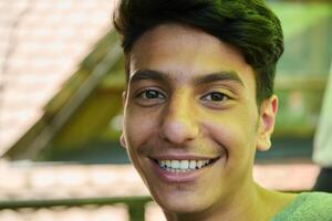 Middle Eastern Man with a Radiant Smile and Beautiful White Teeth Captured in Closeup photo