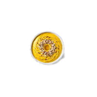 Turmeric chia pudding vibrant yellow base topped with sliced almonds and a swirl of honey png