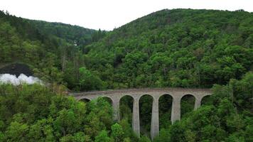 Aerial view of steam locomotive Usata on Zampach viaduct in Czechia video