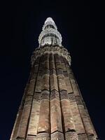 Qutab Minar night view Monument in New Delhi photo