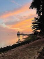 sunset view of kolkata edge of river photo