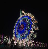 Giant Wheel swing in fair. photo