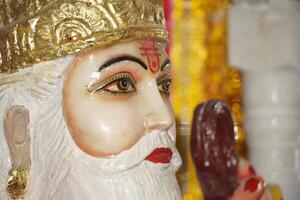 Statue of Vishwakarma close-up face. photo