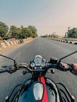 front view of a motorcycle or motorbike driving fast on road photo