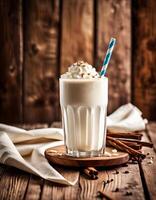 Delicious Vanilla Milkshake in a Glass with a Straw photo