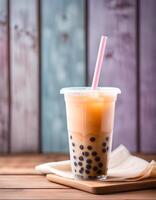 Delicious Brown Sugar Bubble Tea in a Glass with a Straw photo