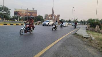 Normal traffic on central highway in city Lahore, Pakistan on May 15, 2024. photo