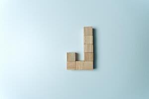 Letter J from wooden dice White Background photo