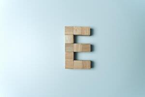 Letter E from wooden dice White Background photo
