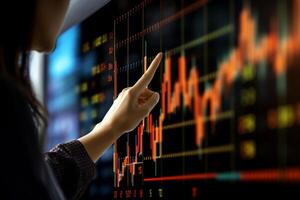 Close up of businesswoman hand pointing at candle stick business chart on monitor, Generated AI photo