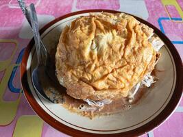 Ketoprak, Traditional Indonesian Dish with Noodles and Egg Topped with Crackers photo