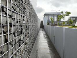 Architectural Exterior, Modern Industrial Walkway with Stone and Metal Fencing photo