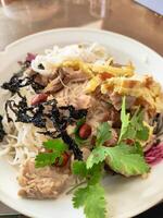 Flavorful Rice Noodles with Meat and Vegetables on a Plate photo