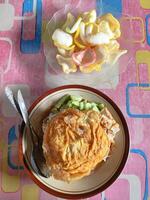 Ketoprak, Traditional Indonesian Dish with Noodles and Egg Topped with Crackers photo