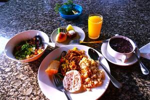 Noodles, poridges, cakes and drink for breakfast on marmer table photo