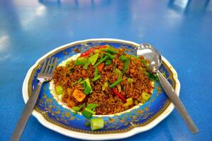A plate of fried rice seasoned with Indian spices photo