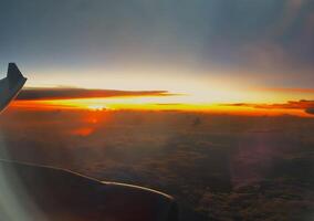 Watching sunset from the window of Aircraft photo