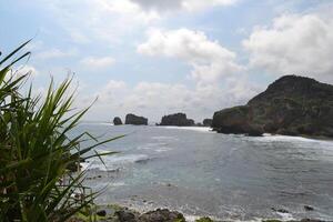 Scenic view of sea against sky in Siung Beach photo