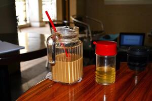 A glass of iced avocado coffee on the table photo