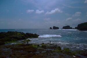 View of scenic beach on cloudy afternoon photo