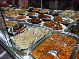 Main dishes and side dishes in display cases photo