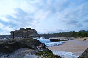 Scenic view of sea against sky in Klayar beach photo