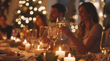 A group of people are sitting around a table with plates of food and celebrating photo