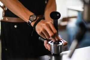 Midsection of Barista making Coffee Beverages photo