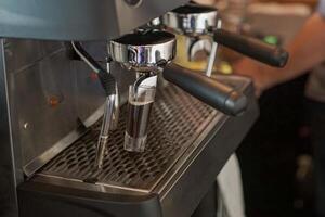 Midsection of Barista making Coffee Beverages photo